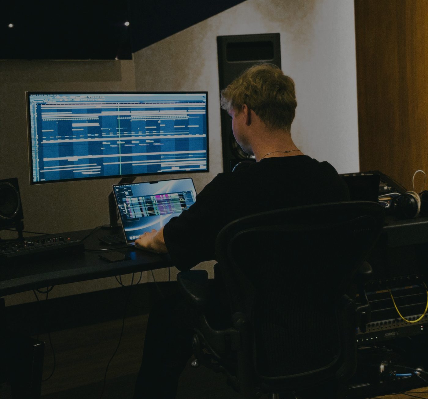 Collin Sterling behind the desk in the studio